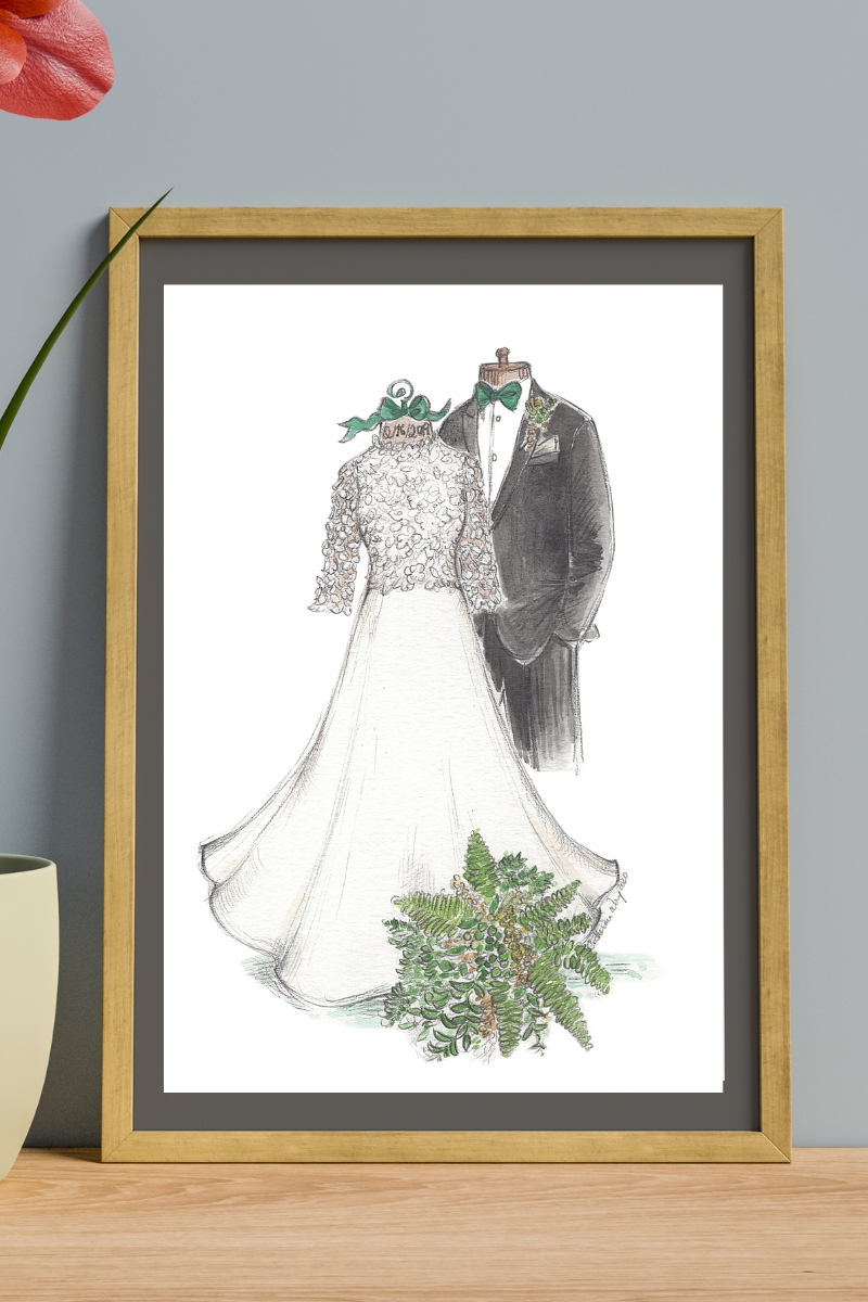 Sketch of wedding gown and suit that is framed